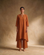 Women Rust Cotton Solid V-Neck Asymmetric Kurta Pant Dupatta Set