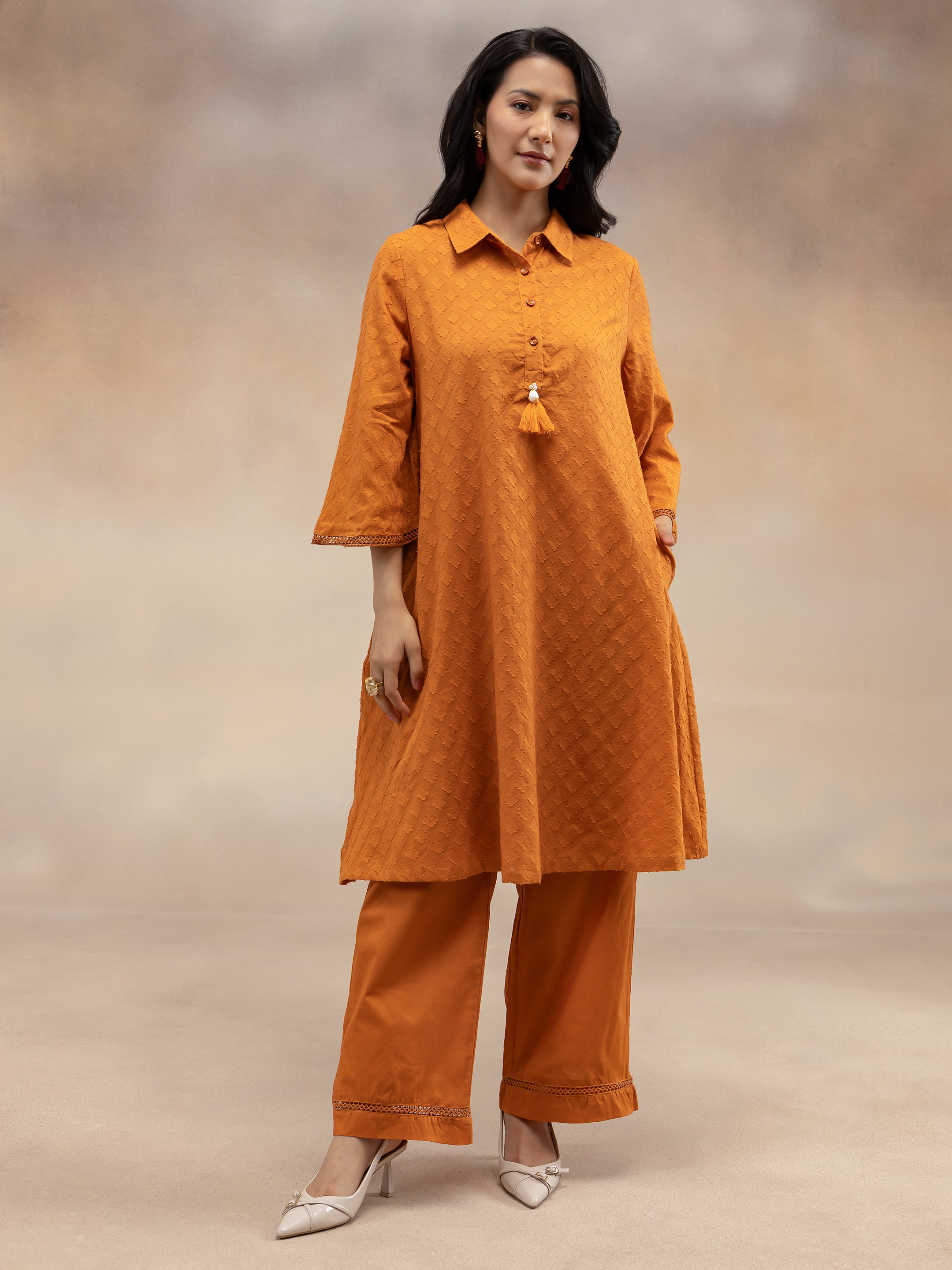 Women Rust Cotton Dobby Textured Kurta Set with Tassel Detail