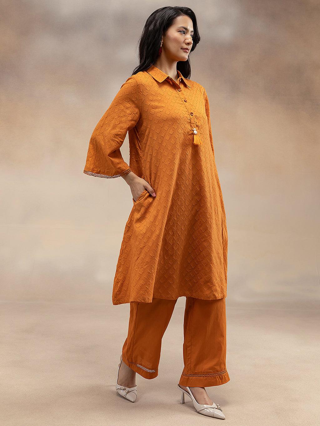Women Rust Cotton Dobby Textured Kurta with Tassel Detail