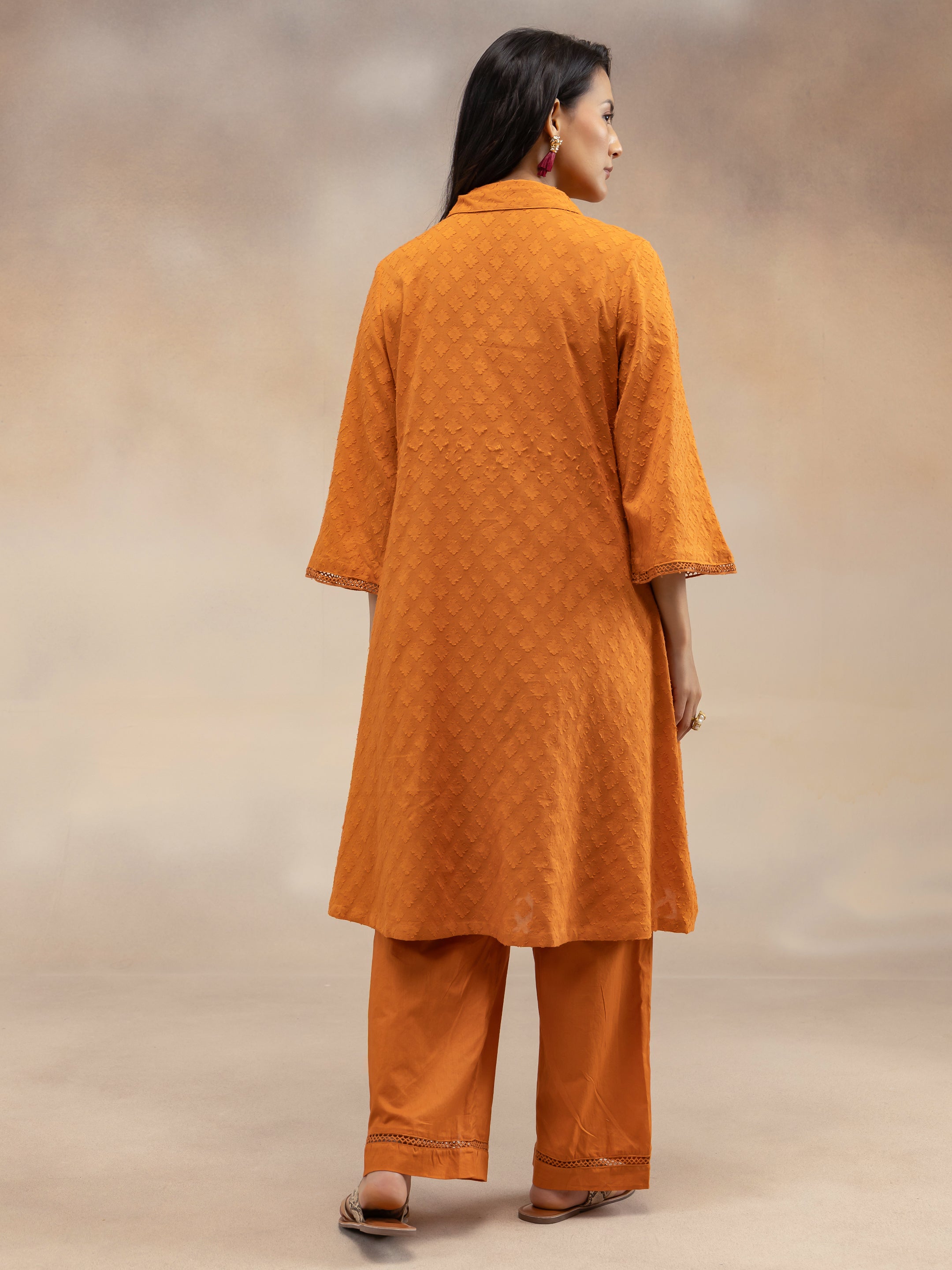 Women Rust Cotton Dobby Textured Kurta Set with Tassel Detail