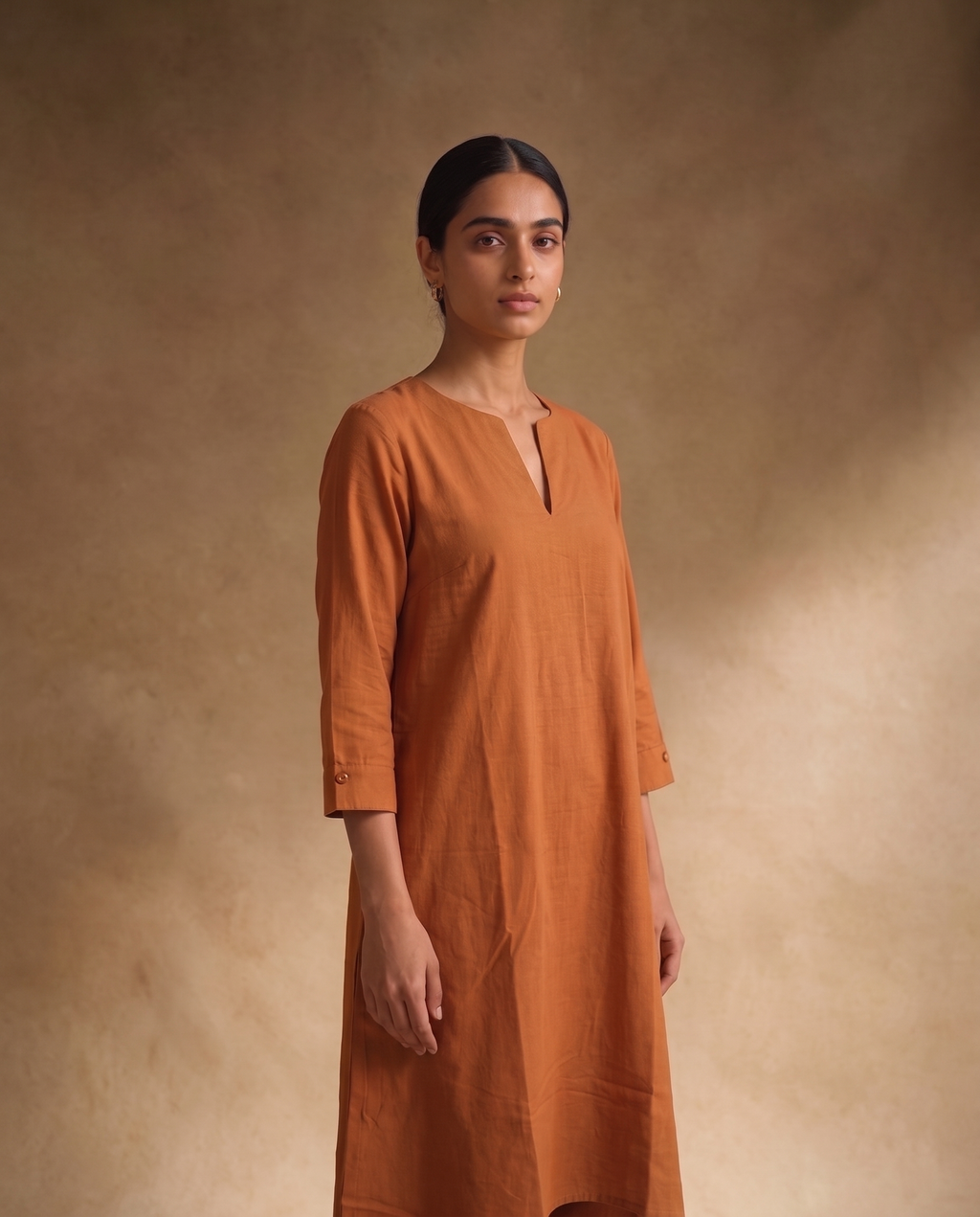 Women Rust Cotton Solid V-Neck Asymmetric Kurta Pant Dupatta Set