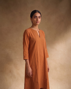 Women Rust Cotton Solid V-Neck Asymmetric Kurta Pant Dupatta Set