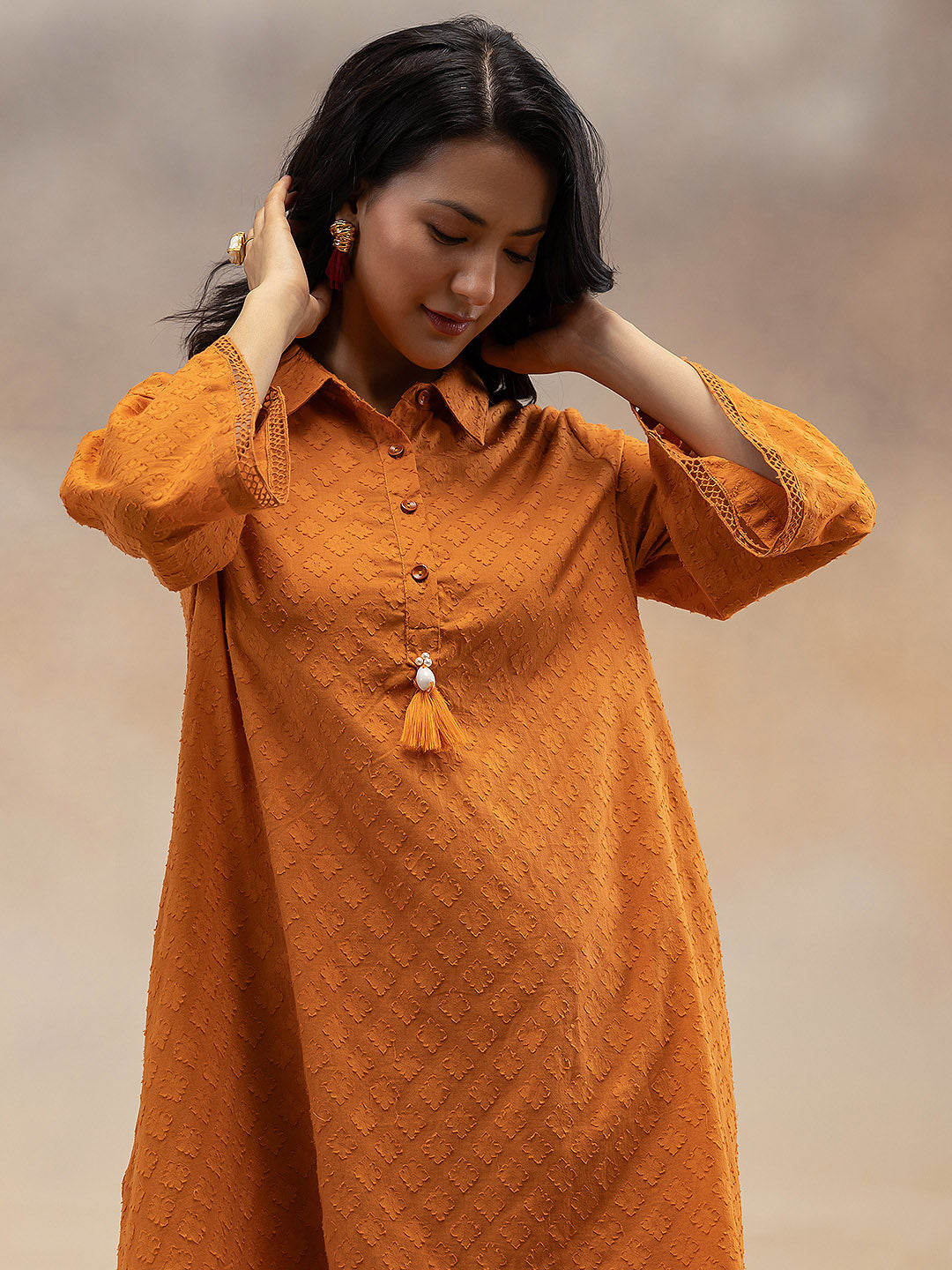 Women Rust Cotton Dobby Textured Kurta with Tassel Detail