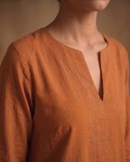 Women Rust Cotton Solid V-Neck Asymmetric Kurta Pant Dupatta Set