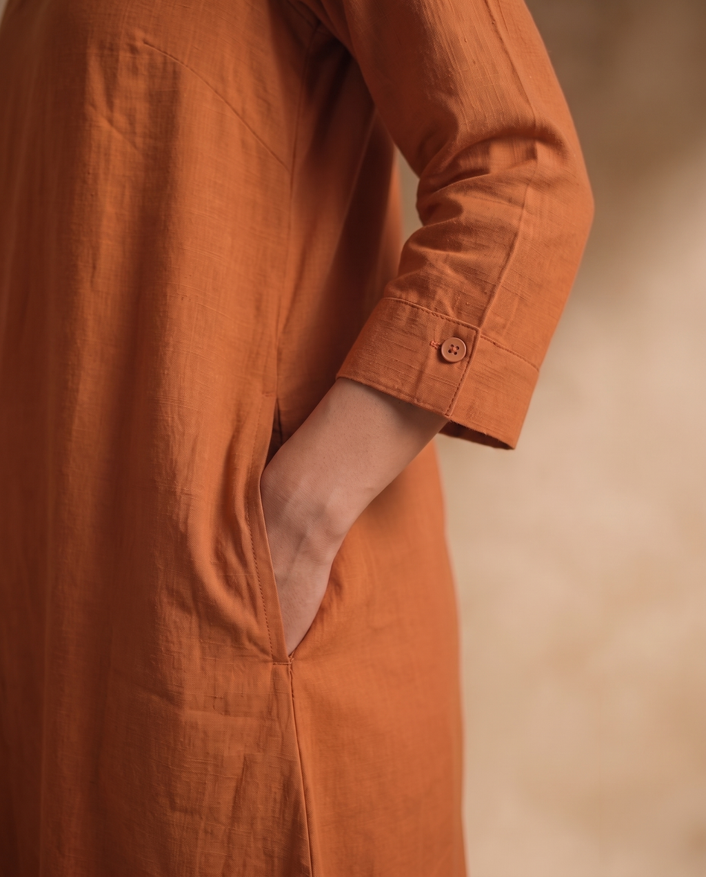 Women Rust Cotton Solid V-Neck Asymmetric Kurta Pant Dupatta Set