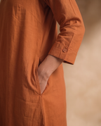 Women Rust Cotton Solid V-Neck Asymmetric Kurta Pant Dupatta Set