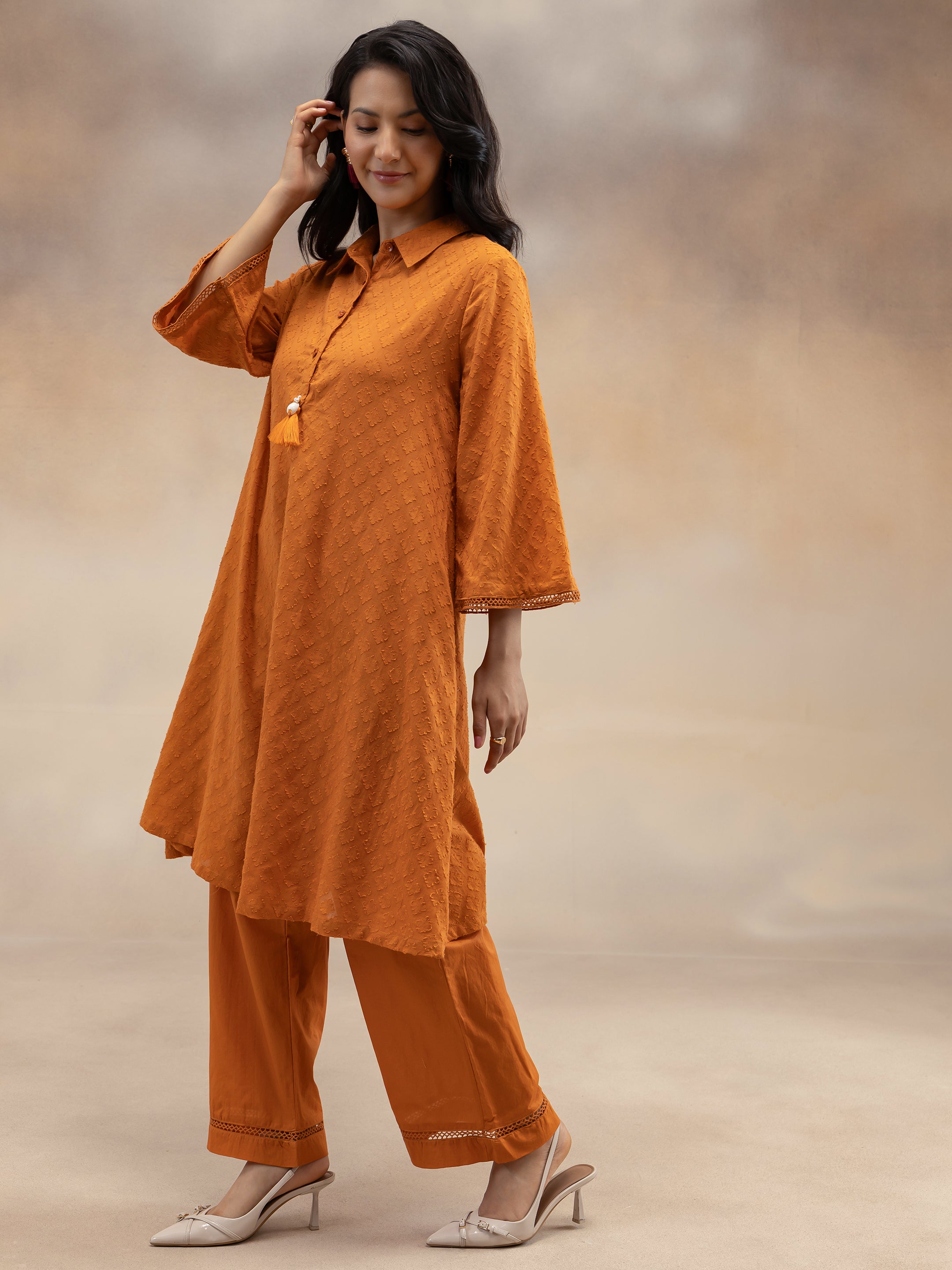 Women Rust Cotton Dobby Textured Kurta Set with Tassel Detail
