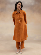 Women Rust Cotton Dobby Textured Kurta Set with Tassel Detail