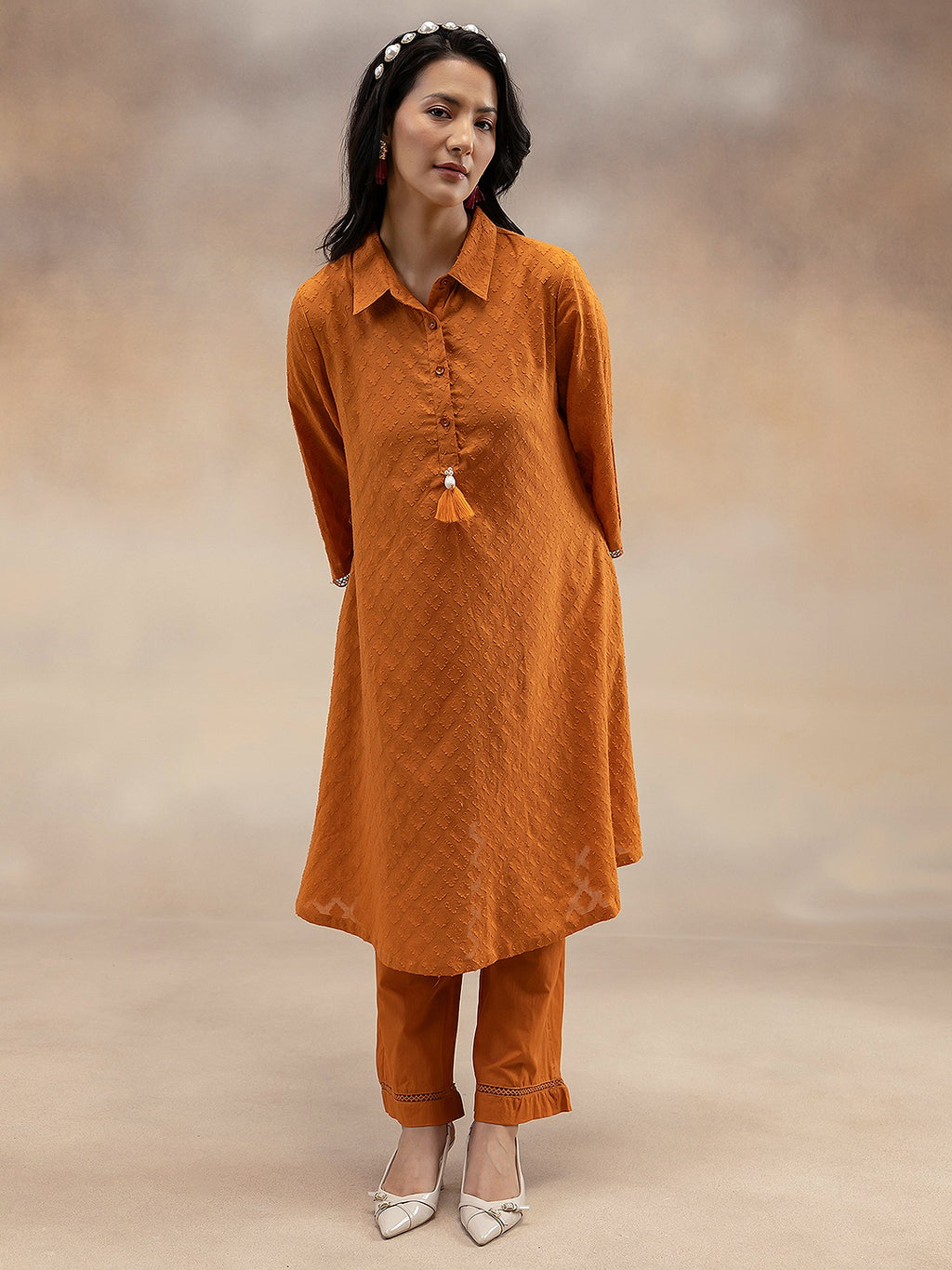 Women Rust Cotton Dobby Textured Kurta Set with Tassel Detail