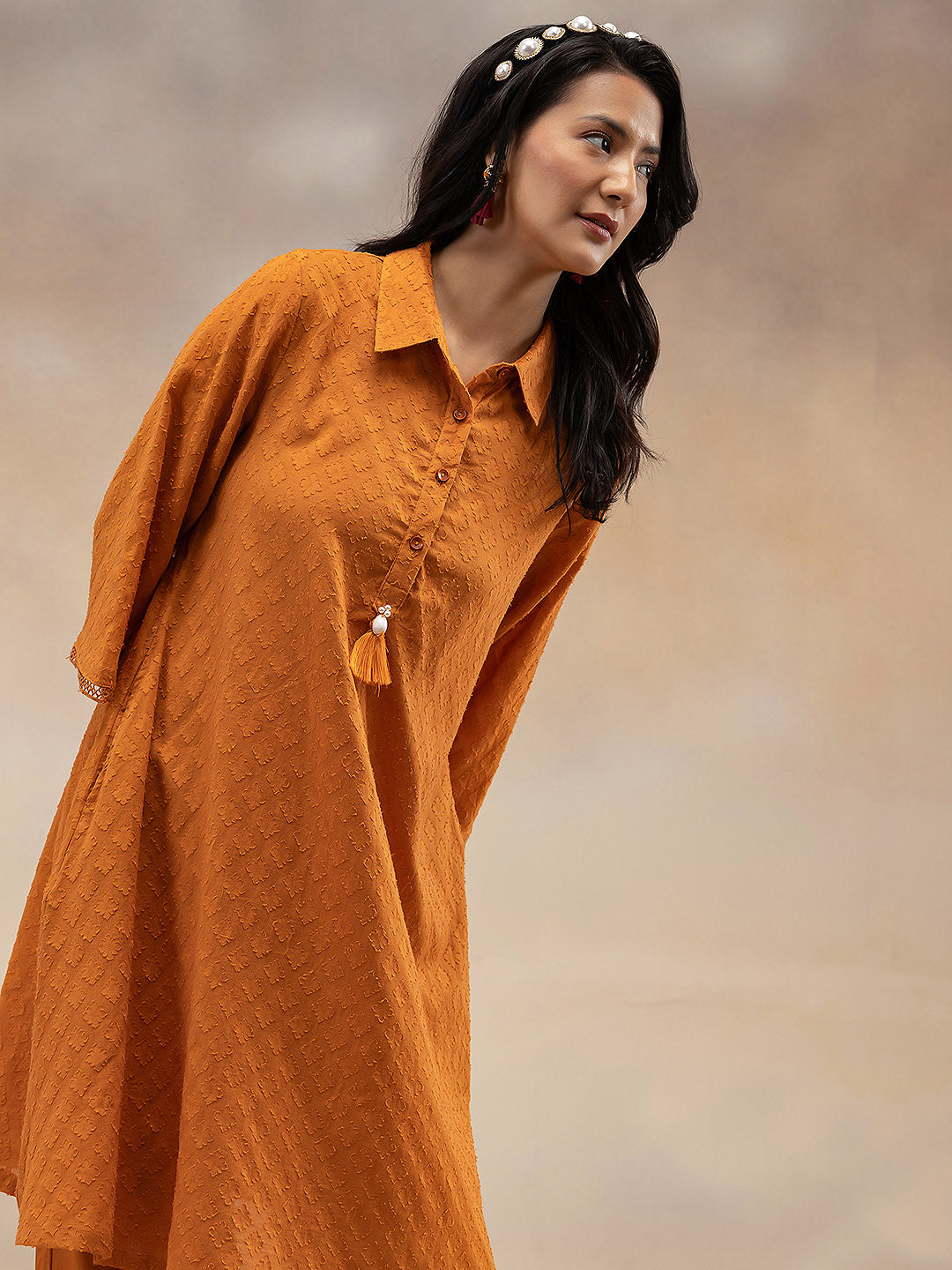Women Rust Cotton Dobby Textured Kurta with Tassel Detail